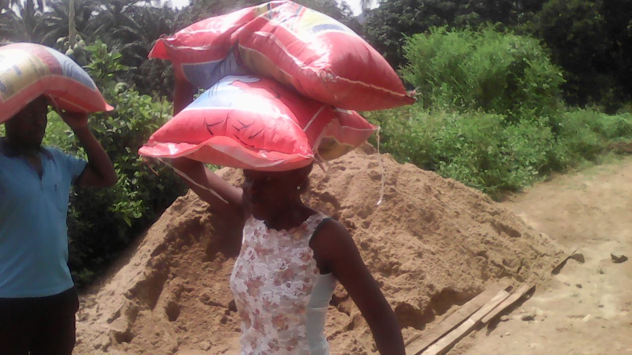 Bags of rice being carried for distribution