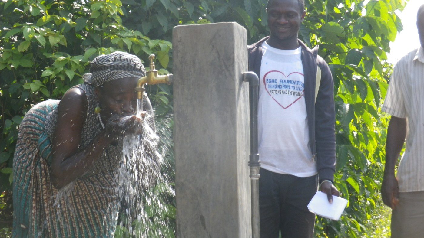 A resident uses the new tap